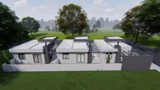 Fachada de uma residência moderna com jardim em Lajeado.