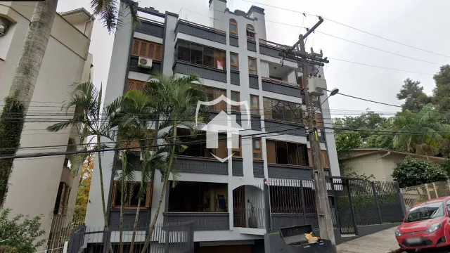 Fachada de um prédio residencial em Lajeado, Brasil, com vários andares e varandas.