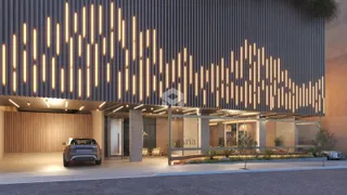 Fachada moderna de um edifício em Lajeado, Brasil, com iluminação vertical.
