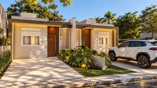 Fachada de uma casa em Lajeado, Brasil, com jardim e entrada pavimentada.