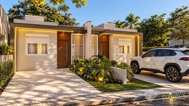 Fachada de uma casa em Lajeado, Brasil, com jardim e entrada pavimentada.