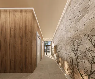 Um corredor interno apresenta paredes de madeira e textura de pedra.