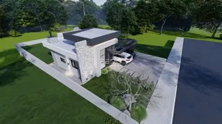 Fachada de uma residência moderna com jardim em Lajeado.