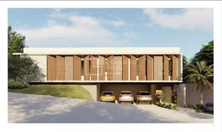 Fachada moderna de uma residência com revestimento de madeira e paredes claras.