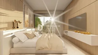 Quarto moderno com cabeceira e painéis de madeira.