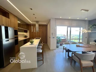 Ambiente moderno de sala de jantar e cozinha em um imóvel no Brasil.