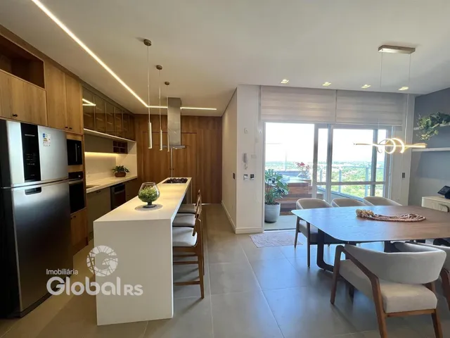Ambiente moderno de sala de jantar e cozinha em um imóvel no Brasil.