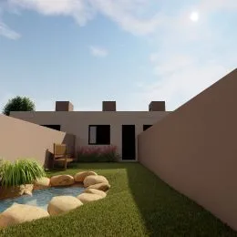 Jardim externo com gramado e água em uma propriedade.