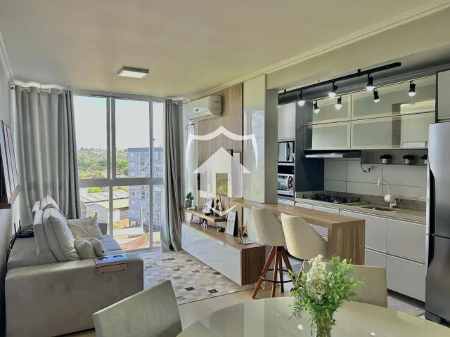 Sala de estar e cozinha de um apartamento em Lajeado, Brasil.