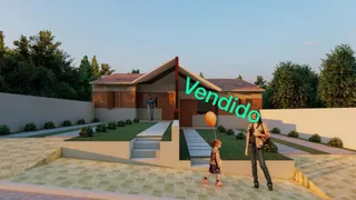Exterior da casa residencial em Lajeado, Brasil, com paisagismo frontal.