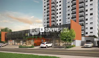 Fachada moderna de um edifício residencial em Lajeado, Brasil, com detalhes em laranja.