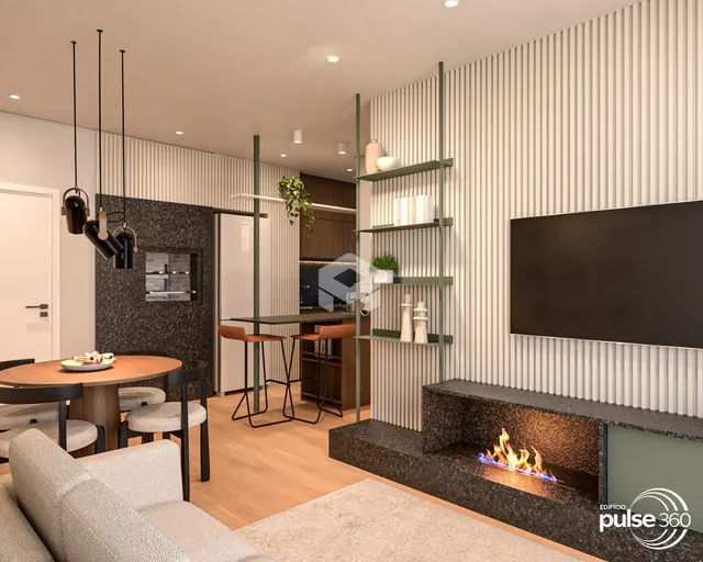 Sala de estar e jantar com lareira em um apartamento moderno.