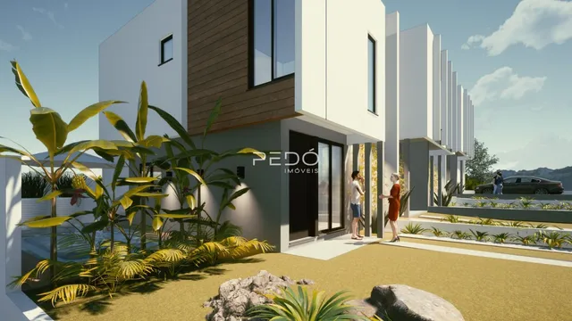 Fachada de uma casa moderna com paisagismo tropical em Lajeado.