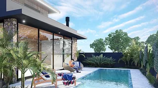 Fachada de casa moderna com piscina e jardim em Lajeado.