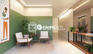 Sala de estar com paredes verdes e duas cadeiras de design.