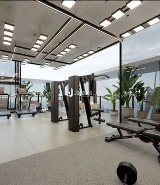 Foto de uma academia interna com equipamentos de musculação.