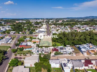 Vista aérea de uma área residencial em Lajeado, mostrando casas e ruas.
