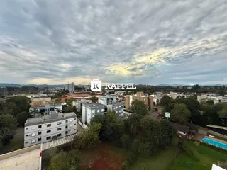 Vista aérea de um complexo residencial com áreas verdes em Lajeado, Brasil.
