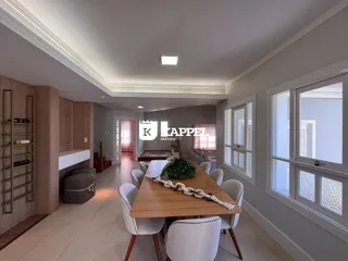 Uma sala de jantar com mesa de madeira e cadeiras claras.