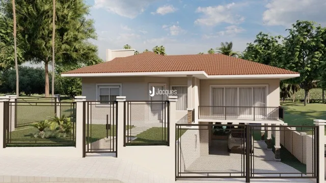 Fachada de uma casa residencial em Lajeado, Brasil com cerca e portão de metal.