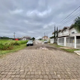 Vista da rua com casas e paisagem em Lajeado, Brasil.