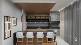 Interior de uma sala de estar moderna com painéis de madeira e ilha de cozinha.