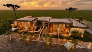 Fachada de uma residência moderna em Lajeado, Brasil, com paisagismo.