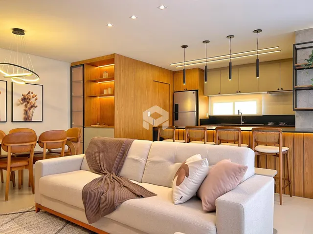 Sala de estar e cozinha de um apartamento moderno em Lajeado.