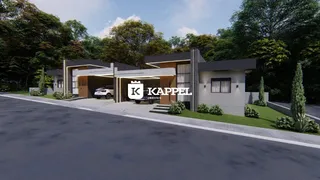 Fachada moderna de uma residência em Lajeado, Brasil, com paisagismo e garagem.