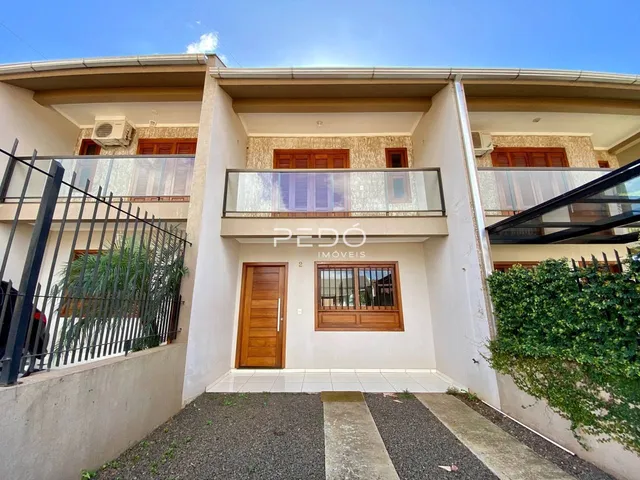 Fachada de um prédio residencial em Lajeado, Brasil, com varandas e grade de segurança.