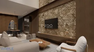 Sala de estar com parede de pedra e decoração moderna.