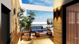 Sala de estar com vista para o mar e decoração moderna.