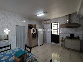 Quarto com decoração e cozinha integrada em Lajeado, Brasil.