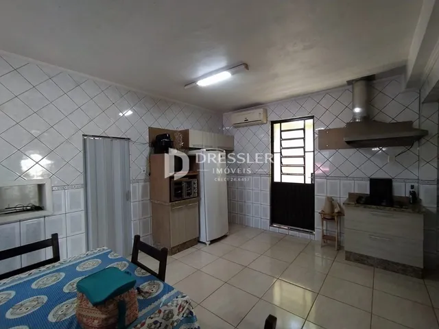 Quarto com decoração e cozinha integrada em Lajeado, Brasil.