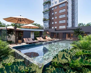 Vista externa de uma piscina com área de lazer e vegetação exuberante em Lajeado.