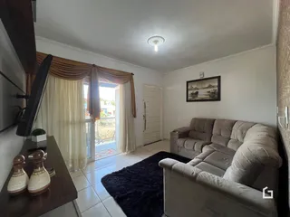 Foto da sala de estar de uma residência em Lajeado, Brasil.