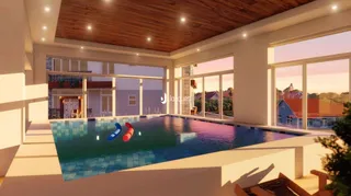 Vista de uma área de lazer com piscina e grandes janelas.