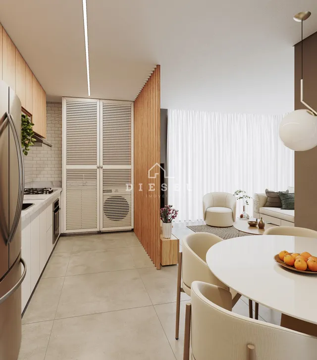 Ambiente moderno de sala de estar e cozinha com iluminação clara em Lajeado.