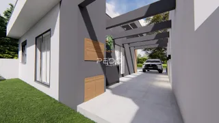 Fachada de uma casa moderna com jardim e entrada coberta em Lajeado, Brasil.