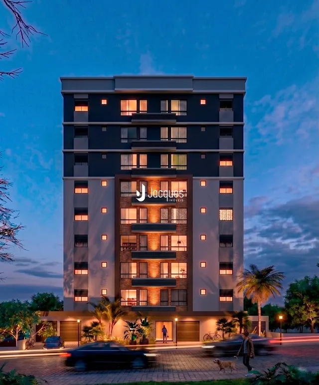 Fachada de um prédio residencial em Lajeado, Brasil ao anoitecer.