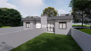 Fachada de uma casa moderna com jardim verde em Lajeado.
