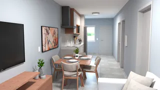 Sala de estar com televisão e móveis de madeira em um ambiente claro.