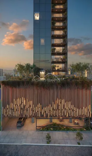 Foto da fachada de um edifício moderno com estrutura de vidro e varandas em Lajeado.