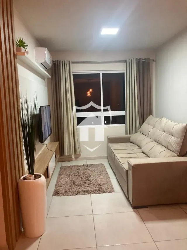 Sala de estar com sofá e piso claro.