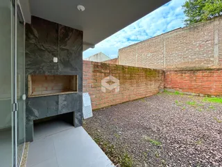 Parede de tijolos e área externa de uma propriedade em Lajeado, Brasil.
