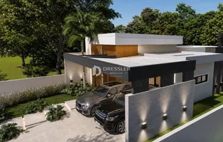 Fachada de uma residência em Lajeado, Brasil, com jardim e garagem.