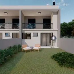 Fachada de uma casa moderna em Lajeado com jardim na frente.