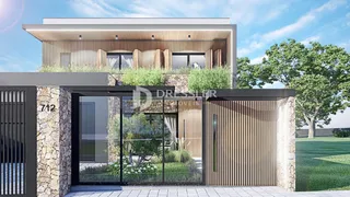 Fachada moderna de uma residência em Lajeado, Brasil, com revestimento de pedra e madeira.