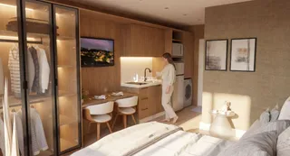 Quarto com cama e guarda-roupa de madeira.