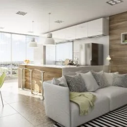 Sala de estar com bancada e móveis claros em ambiente moderno.